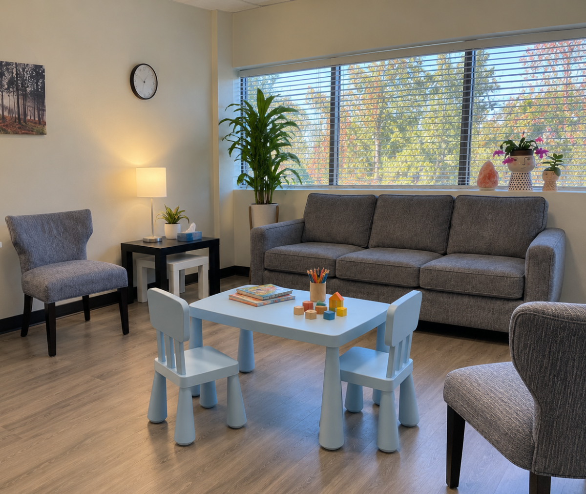 Child therapy room at Aspire Counseling Group in Arcadia, California with child-sized table, chairs, books, and therapy toys